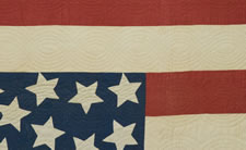 AN AMERICAN FOLK ART MASTERPIECE:  CIVIL WAR PERIOD AMERICAN FLAG QUILT WITH AN EAGLE PERCHED ON A GLOBE AMIDST 34 STARS, 1861-63, PROBABLY OF NEW YORK ORIGIN