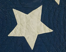 AN AMERICAN FOLK ART MASTERPIECE:  CIVIL WAR PERIOD AMERICAN FLAG QUILT WITH AN EAGLE PERCHED ON A GLOBE AMIDST 34 STARS, 1861-63, PROBABLY OF NEW YORK ORIGIN