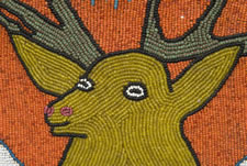 AMERICAN INDIAN BEADWORK MAIL POUCH WITH IMAGE OF AN ELK/STAG, CA 1880-90, NEZ PERCE, PACIFIC NORTHWEST.  THE PAINT DECORATED AND VENEERED MOLDING IS CA 1830-50