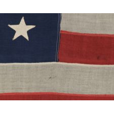 ANTIQUE 38 STAR FLAG WITH HAND-SEWN STARS, IN A SMALL SCALE AMONG PIECED-AND-SEWN EXAMPLES, WITH WONDERFUL FOLK QUALITIES, COLORADO STATEHOOD, 1876-1889