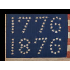 ANTIQUE AMERICAN FLAG WITH 10-POINTED STARS THAT SPELL “1776 – 1876”, MADE FOR THE 100-YEAR ANNIVERSARY OF AMERICAN INDEPENDENCE, ONE OF THE MOST GRAPHIC OF ALL EARLY EXAMPLES