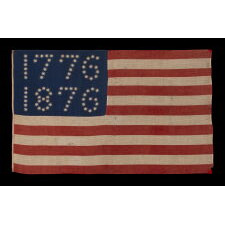 ANTIQUE AMERICAN FLAG WITH 10-POINTED STARS THAT SPELL “1776 – 1876”, MADE FOR THE 100-YEAR ANNIVERSARY OF AMERICAN INDEPENDENCE, ONE OF THE MOST GRAPHIC OF ALL EARLY EXAMPLES