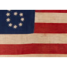 ANTIQUE AMERICAN FLAG WITH 10-POINTED STARS THAT SPELL “1776 – 1876”, MADE FOR THE 100-YEAR ANNIVERSARY OF AMERICAN INDEPENDENCE, ONE OF THE MOST GRAPHIC OF ALL EARLY EXAMPLES