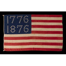 ANTIQUE AMERICAN FLAG WITH 10-POINTED STARS THAT SPELL “1776 – 1876”, MADE FOR THE 100-YEAR ANNIVERSARY OF AMERICAN INDEPENDENCE, ONE OF THE MOST GRAPHIC OF ALL EARLY EXAMPLES