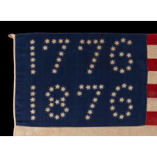 ANTIQUE AMERICAN FLAG WITH 10-POINTED STARS THAT SPELL “1776 – 1876”, MADE FOR THE 100-YEAR ANNIVERSARY OF AMERICAN INDEPENDENCE, ONE OF THE MOST GRAPHIC OF ALL EARLY EXAMPLES