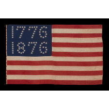 ANTIQUE AMERICAN FLAG WITH 10-POINTED STARS THAT SPELL “1776 – 1876”, MADE FOR THE 100-YEAR ANNIVERSARY OF AMERICAN INDEPENDENCE, ONE OF THE MOST GRAPHIC OF ALL EARLY EXAMPLES
