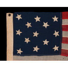 ANTIQUE AMERICAN FLAG WITH 13 HAND-SEWN STARS IN A 3-2-3-2-3 CONFIGURATION, MADE IN THE ERA OF THE 1876 CENTENNIAL OF AMERICAN INDEPENDENCE, IN AN EXTRAORDINARY AND VERY DESIRABLE SIZE AMONG ITS COUNTERPARTS