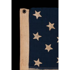 ANTIQUE AMERICAN FLAG WITH 13 HAND-SEWN STARS IN A 3-2-3-2-3 CONFIGURATION, MADE IN THE ERA OF THE 1876 CENTENNIAL OF AMERICAN INDEPENDENCE, IN AN EXTRAORDINARY AND VERY DESIRABLE SIZE AMONG ITS COUNTERPARTS
