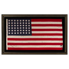 ANTIQUE AMERICAN FLAG WITH 48 STARS, A U.S. NAVY SMALL BOAT ENSIGN, MADE DURING WWII, IN DECEMBER OF 1943, AT MARE ISLAND, CALIFORNIA, HEADQUARTERS OF THE PACIFIC FLEET, SIGNED & DATED