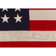 ANTIQUE AMERICAN FLAG WITH 48 STARS, A U.S. NAVY SMALL BOAT ENSIGN, MADE DURING WWII, IN DECEMBER OF 1943, AT MARE ISLAND, CALIFORNIA, HEADQUARTERS OF THE PACIFIC FLEET, SIGNED & DATED