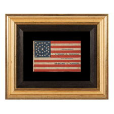 ANTIQUE AMERICAN FLAG MADE FOR THE 1860 PRESIDENTIAL CAMPAIGN OF NORTHERN DEMOCRAT CANDIDATES STEPHEN DOUGLAS & HERSCHEL JOHNSON, WITH 31 STARS CONFIGURED IN A RARE MEDALLION VARIANT THAT FEATURES A TEARDROP-LIKE FORMATION SET WITHIN A CIRCULAR WREATH, THE ONLY KNOWN EXAMPLE IN THIS STYLE