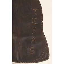 ANTIQUE, BATWING, LEATHER CHAPS WITH GREAT PATINA AND “TEXAS” SPELLED OUT IN THE STUDS, circa 1915-1930