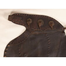 ANTIQUE, BATWING, LEATHER CHAPS WITH GREAT PATINA AND “TEXAS” SPELLED OUT IN THE STUDS, circa 1915-1930