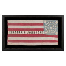 ONE OF THE TWO BEST OF ALL KNOWN FLAGS ADVERTISING ABRAHAM LINCOLN’S 1864 INCUMBENT PRESIDENTIAL CAMPAIGN FOR THE WHITE HOUSE, WITH VICE PRESIDENTIAL RUNNING MATE ANDREW JOHNSON; ENTIRELY HAND-SEWN, WITH A DOUBLE-WREATH CONFIGURATION OF 34 STARS, IN THREE DIFFERENT SIZES, THAT FEATURES HUGE STARS IN EACH CORNER, WITH 9 STRIPES AND WITH ITS CANTON RESTING ON THE WAR STRIPE, BOLD LETTERING , AND IN AN IDEAL SCALE AMONG ALL FLAGS OF THIS ERA