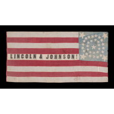 ONE OF THE TWO BEST OF ALL KNOWN FLAGS ADVERTISING ABRAHAM LINCOLN’S 1864 INCUMBENT PRESIDENTIAL CAMPAIGN FOR THE WHITE HOUSE, WITH VICE PRESIDENTIAL RUNNING MATE ANDREW JOHNSON; ENTIRELY HAND-SEWN, WITH A DOUBLE-WREATH CONFIGURATION OF 34 STARS, IN THREE DIFFERENT SIZES, THAT FEATURES HUGE STARS IN EACH CORNER, WITH 9 STRIPES AND WITH ITS CANTON RESTING ON THE WAR STRIPE, BOLD LETTERING , AND IN AN IDEAL SCALE AMONG ALL FLAGS OF THIS ERA