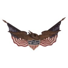 CARVED EAGLE BY GEORGE STAPF, HARRISBURG, PENNSYLVANIA, AN EXCEPTIONAL EXAMPLE WITH TWO OUTSTRETCHED AMERICAN FLAGS AND A FEDERAL SHIELD, ONE OF JUST TWO KNOWN EXAMPLES WITH COMMERCIAL ADVERTISING, MADE CIRCA 1890-WWI