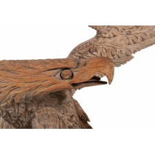 CARVED WOODEN EAGLE OF THE EARLY 19TH CENTURY, WITH EXUBERANT, THREE-DIMENSIONAL FORM AND A NEARLY 6-FOOT WINGSPAN, PERCHED ON A ROCKY OUTCROP