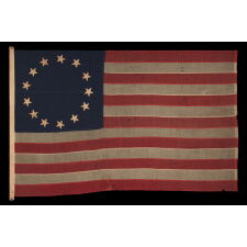 13 STAR ANTIQUE AMERICAN FLAG IN THE BETSY ROSS PATTERN, ONE OF JUST THREE EXAMPLES THAT I HAVE ENCOUNTERED THAT PRE-DATE THE 1890’s; AN EXTRAORDINARY FIND, CIVIL WAR PERIOD (1861-1865) OR JUST AFTER, EXTREMELY LARGE AMONG ITS COUNTERPARTS OF ALL PERIODS IN THIS DESIGN