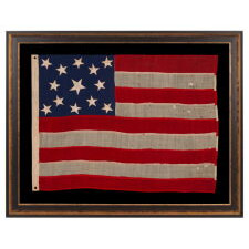 13 STAR ANTIQUE AMERICAN FLAG OF THE CIVIL WAR PERIOD (1861-1865), WITH 9 STRIPES TO REFLECT THE OMISSION OF NORTH & SOUTH CAROLINA, GEORGIA, & VIRGINIA, THE 4 SLAVE STATES AMONG THE ORIGINAL 13 COLONIES THAT SECEDED FROM THE UNION, WITH ITS CANTON RESTING ON THE WAR STRIPE, STRIKING COLOR, AND A BEAUTIFUL MEDALLION CONFIGURATION