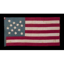 13 STAR ANTIQUE AMERICAN FLAG OF THE CIVIL WAR PERIOD (1861-1865), HOMEMADE AND ENTIRELY HAND-SEWN, WITH ITS CANTON RESTING ON THE WAR STRIPE, AND WITH 9 STRIPES TO REFLECT THE OMISSION OF NORTH & SOUTH CAROLINA, GEORGIA, AND VIRGINIA, THE 4 SLAVE STATES AMONG THE ORIGINAL 13 COLONIES THAT SECEDED FROM THE UNION