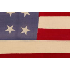 34 STAR MERINO WOOL FLAG OF THE CIVIL WAR PERIOD, WITH ITS STARS ORIENTED IN VARIOUS DIRECTIONS ON A PERIWINKLE BLUE CANTON; HIGHLY UNUSUAL; REFLECTS THE ADDITION OF KANSAS TO THE UNION AS A FREE STATE, circa 1861-1863