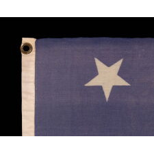 34 STAR MERINO WOOL FLAG OF THE CIVIL WAR PERIOD, WITH ITS STARS ORIENTED IN VARIOUS DIRECTIONS ON A PERIWINKLE BLUE CANTON; HIGHLY UNUSUAL; REFLECTS THE ADDITION OF KANSAS TO THE UNION AS A FREE STATE, circa 1861-1863