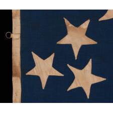 36 STARS IN THE "GREAT STAR" OR "GREAT LUMINARY" PATTERN, ON A MERINO WOOL FLAG OF THE CIVIL WAR ERA WITH BEAUTIFUL SCARLET AND ROYAL BLUE COLOR AND WITH ITS CANTON RESTING ON THE "WAR STRIPE," REFLECTS NEVADA STATEHOOD, 1864-67