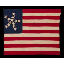 ANTIQUE AMERICAN FLAG OF THE CIVIL WAR PERIOD, WITH 13 STARS IN A "PINWHEEL GREAT STAR," A MASTERPIECE OF EARLY AMERICAN FLAG-MAKING