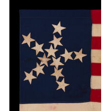 ANTIQUE AMERICAN FLAG OF THE CIVIL WAR PERIOD, WITH 13 STARS IN A "PINWHEEL GREAT STAR," A MASTERPIECE OF EARLY AMERICAN FLAG-MAKING