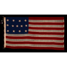 13 STARS IN THE 4-5-4 PATTERN ON AN ENTIRELY HAND-SEWN FLAG OF THE CIVIL WAR PERIOD, OR JUST PRIOR, circa 1854-1864, WITH HEMP ROPE AND A SINGLE TASSEL; PROBABLY A U.S. NAVY SMALL BOAT ENSIGN; SIGNED “JENNIE B. SEAVER,” NEWTON, MASSACHUSETTS