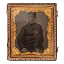 29 STARS IN A SPECTACULAR CROSS OR STARBURST MEDALLION, ONE OF JUST TWO KNOWN EXAMPLES IN THIS STYLE, PRE-CIVIL WAR, 1846-48, MEXICAN WAR PERIOD, REFLECTS THE ADDITION OF IOWA AS THE 29TH STATE; FORMERLY AMONG THE POSSESSIONS OF CORPORAL NATHANIEL POWERS, COLOR BEARER IN THE 10TH MASSACHUSETTS VOLUNTEERS, WHO LOST HIS ARM AT THE BATTLE OF FAIR OAKS, VIRGINIA IN 1862; THE FLAG-ITS STAFF WRAPPED IN BLACK CREPE—IS REPORTED TO HAVE BEEN DISTRIBUTED TO MOURNERS IN THE STREETS OF WASHINGTON, DC, ON