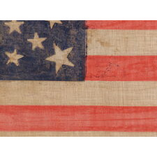 30 STARS ON AN ANTIQUE AMERICAN FLAG OF THE PRE-CIVIL WAR ERA, RARE AND BEAUTIFUL, WITH A MEDALLION CONFIGURATION THAT FEATURES A HALOED CENTER STAR, WISCONSIN STATEHOOD, 1848-1850