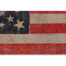 30 STARS ON AN ANTIQUE AMERICAN FLAG OF THE PRE-CIVIL WAR ERA, WITH A DOUBLE-WREATH STYLE MEDALLION CONFIGURATION THAT FEATURES A LARGE, HALOED CENTER STAR, WISCONSIN STATEHOOD, 1848-1850