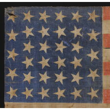 34 STARS ON AN ANTIQUE AMERICAN PARADE FLAG OF THE CIVIL WAR PERIOD, LARGE AMONG ITS COUNTERPARTS, WITH EXTENSIVE AND ENDEARING WEAR FROM OBVIOUS LONG-TERM USE; REFLECTS THE ERA WHEN KANSAS WAS THE MOST RECENT STATE TO JOIN THE UNION, 1861-63