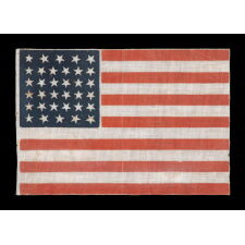 34 STARS, WITH SCATTERED POSITIONING, ON AN ANTIQUE AMERICAN PARADE FLAG MADE DURING THE OPENING TWO YEARS OF THE CIVIL WAR, 1861-63, KANSAS STATEHOOD