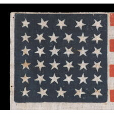 34 STARS, WITH SCATTERED POSITIONING, ON AN ANTIQUE AMERICAN PARADE FLAG MADE DURING THE OPENING TWO YEARS OF THE CIVIL WAR, 1861-63, KANSAS STATEHOOD