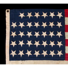 34 UPSIDE-DOWN, HAND-SEWN STARS IN A NOTCHED CONFIGURATION, ON AN ANTIQUE AMERICAN FLAG OF THE CIVIL WAR PERIOD, WITH A SQUARISH PROFILE AND IN AN EXTREMELY SMALL SCALE AMONG ITS COUNTERPARTS; FOUND IN PENNSYLVANIA & RELATED TO ANOTHER FLAG FOUND IN THE RAFTERS OF A BARN IN PERRY COUNTY; REFLECTS THE ADDITION OF KANSAS AS THE 34TH STATE, circa 1861-1863