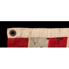 34 UPSIDE-DOWN, HAND-SEWN STARS IN A NOTCHED CONFIGURATION, ON AN ANTIQUE AMERICAN FLAG OF THE CIVIL WAR PERIOD, WITH A SQUARISH PROFILE AND IN AN EXTREMELY SMALL SCALE AMONG ITS COUNTERPARTS; FOUND IN PENNSYLVANIA & RELATED TO ANOTHER FLAG FOUND IN THE RAFTERS OF A BARN IN PERRY COUNTY; REFLECTS THE ADDITION OF KANSAS AS THE 34TH STATE, circa 1861-1863