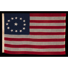 ENTIRELY HAND-SEWN ANTIQUE AMERICAN FLAG OF THE CIVIL WAR PERIOD, WITH 13 SINGLE-APPLIQUED STARS IN A BEAUTIFUL, OVAL ARRANGEMENT OF WHAT IS KNOWN AS THE 3RD MARYLAND PATTERN, MADE SOMETIME BETWEEN THE 1850’s AND THE CIVIL WAR (1861-65)