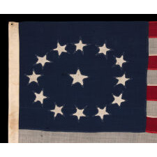 ENTIRELY HAND-SEWN ANTIQUE AMERICAN FLAG OF THE CIVIL WAR PERIOD, WITH 13 SINGLE-APPLIQUED STARS IN A BEAUTIFUL, OVAL ARRANGEMENT OF WHAT IS KNOWN AS THE 3RD MARYLAND PATTERN, MADE SOMETIME BETWEEN THE 1850’s AND THE CIVIL WAR (1861-65)