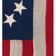 ENTIRELY HAND-SEWN ANTIQUE AMERICAN FLAG OF THE CIVIL WAR PERIOD, WITH 13 SINGLE-APPLIQUED STARS IN A BEAUTIFUL, OVAL ARRANGEMENT OF WHAT IS KNOWN AS THE 3RD MARYLAND PATTERN, MADE SOMETIME BETWEEN THE 1850’s AND THE CIVIL WAR (1861-65)