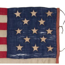 ENTIRELY HAND-SEWN ANTIQUE AMERICAN FLAG OF THE CIVIL WAR ERA, WITH 13 SINGLE-APPLIQUÉD STARS IN A 3-2-3-2-3 CONFIGURATION, IN A GREAT, SMALL SCALE AMONG ITS COUNTERPARTS, PROBABLY MADE IN NEW YORK CITY, SIGNED “GRÜNFILD”