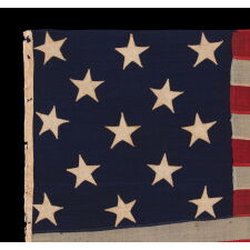 ENTIRELY HAND-SEWN, 13 STAR AMERICAN FLAG, WITH A 3-2-3-2-3 ARRANGEMENT OF STARS, U.S. NAVY SMALL BOAT ENSIGN, LIKELY MADE DURING THE CLOSING YEARS OF THE CIVIL WAR, 1864-1865