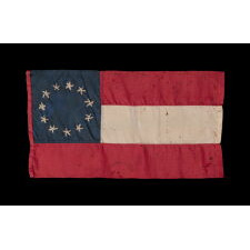 CONFEDERATE BIBLE FLAG IN THE FIRST NATIONAL FORMAT WITH 11 STARS IN A SINGLE WREATH, MADE OF SILK, PROBABLY TAKEN BY A UNION NAVY MAN DURING THE SIEGE OF VICKSBURG WHILE PILOTING THE U.S.S. LILY, A STEAMER TUG CONSCRIPTED INTO SERVICE BY THE U.S. ARMY, FITTED WITH GUNS, TRANSFERRED TO THE NAVY, AND SUNK AFTER COLLIDING WITH THE U.S.S. CHOCTAW, A UNION, IRONCLAD RAM