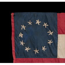 CONFEDERATE BIBLE FLAG IN THE FIRST NATIONAL FORMAT WITH 11 STARS IN A SINGLE WREATH, MADE OF SILK, PROBABLY TAKEN BY A UNION NAVY MAN DURING THE SIEGE OF VICKSBURG WHILE PILOTING THE U.S.S. LILY, A STEAMER TUG CONSCRIPTED INTO SERVICE BY THE U.S. ARMY, FITTED WITH GUNS, TRANSFERRED TO THE NAVY, AND SUNK AFTER COLLIDING WITH THE U.S.S. CHOCTAW, A UNION, IRONCLAD RAM