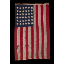 ENTIRELY HAND-SEWN, ANTIQUE AMERICAN FLAG OF THE CIVIL WAR ERA, WITH 36 SINGLE-APPLIQUÉD STARS, REFLECTS NEVADA STATEHOOD, 1864-1867, TINY IN SCALE AMONG ITS COUNTERPARTS, MADE BY ANNIN IN NEW YORK CITY