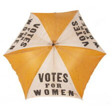 EXTRAORDINARILY RARE, YELLOW & WHITE, SUFFRAGE PARASOL / UMBRELLA, WITH “VOTES FOR WOMEN” TEXT, DISTRIBUTED BY THE NATIONAL AMERICAN WOMEN’S SUFFRAGE ASSOCIATION UNDER ANNA HOWARD SHAW’S LEADERSHIP [HEADQUARTERED IN NEW YORK], CIRCA 1913-1915