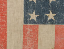 EXTREMELY RARE 36 STAR FLAG WITH A SIX COLOR OVERPRINT THAT INCLUDES THE FIGURE OF LADY COLUMBIA, MADE FOR THE 1876 CENTENNIAL EXPOSITION, POSSIBLY DISTRIBUTED DURING THE PRESIDENTIAL CAMPAIGN OF RUTHERFORD B. HAYES