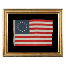 13 HAND-EMBROIDERED STARS AND EXPERTLY HAND-SEWN STRIPES ON AN ANTIQUE AMERICAN FLAG MADE IN PHILADELPHIA BY SARAH M. WILSON, GREAT-GRANDDAUGHTER OF BETSY ROSS, SIGNED & DATED 1910; THE LARGEST KNOWN EXAMPLE OF THIS VARIETY, MADE AND SOLD TO TOURISTS AT INDEPENDENCE HALL