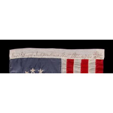 13 HAND-EMBROIDERED STARS AND EXPERTLY HAND-SEWN STRIPES ON AN ANTIQUE AMERICAN FLAG MADE IN PHILADELPHIA BY SARAH M. WILSON, GREAT-GRANDDAUGHTER OF BETSY ROSS, SIGNED & DATED 1911